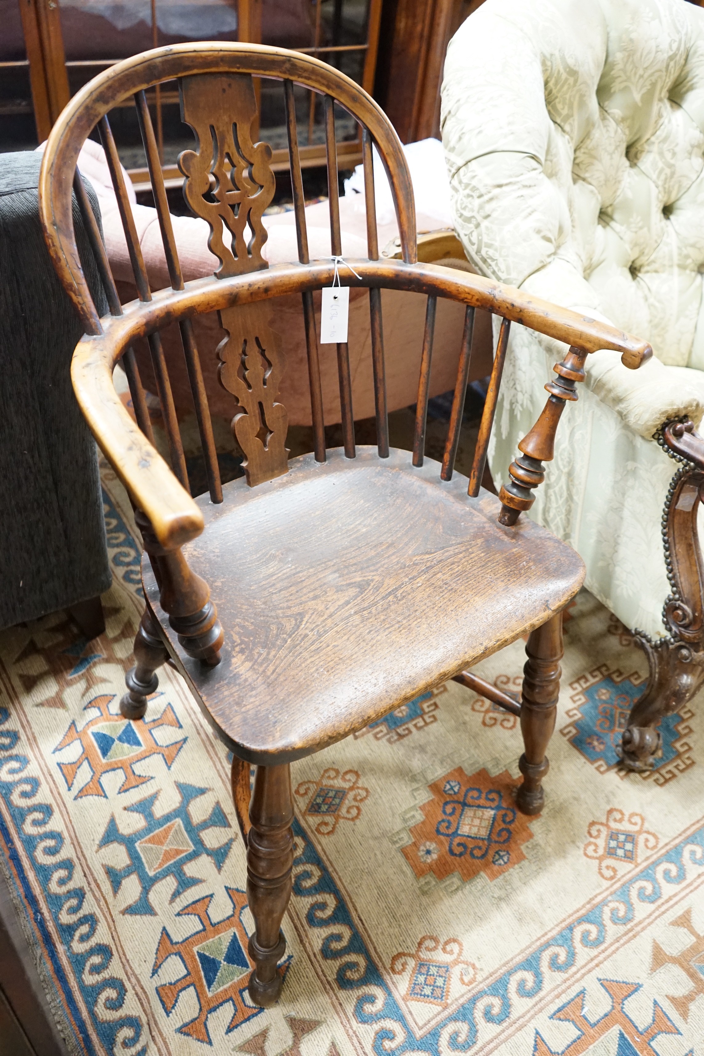 A mid 19th century Yorkshire area Windsor yew and elm elbow chair with crinoline stretcher, width 59cm, depth 39cm, height 94cm